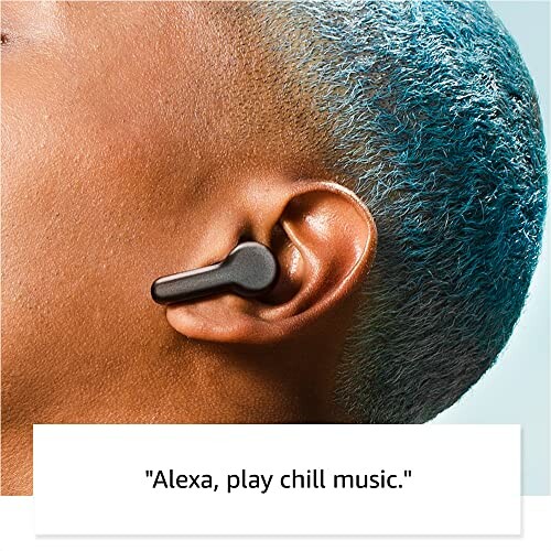 Person with blue hair wearing a black wireless earbud.